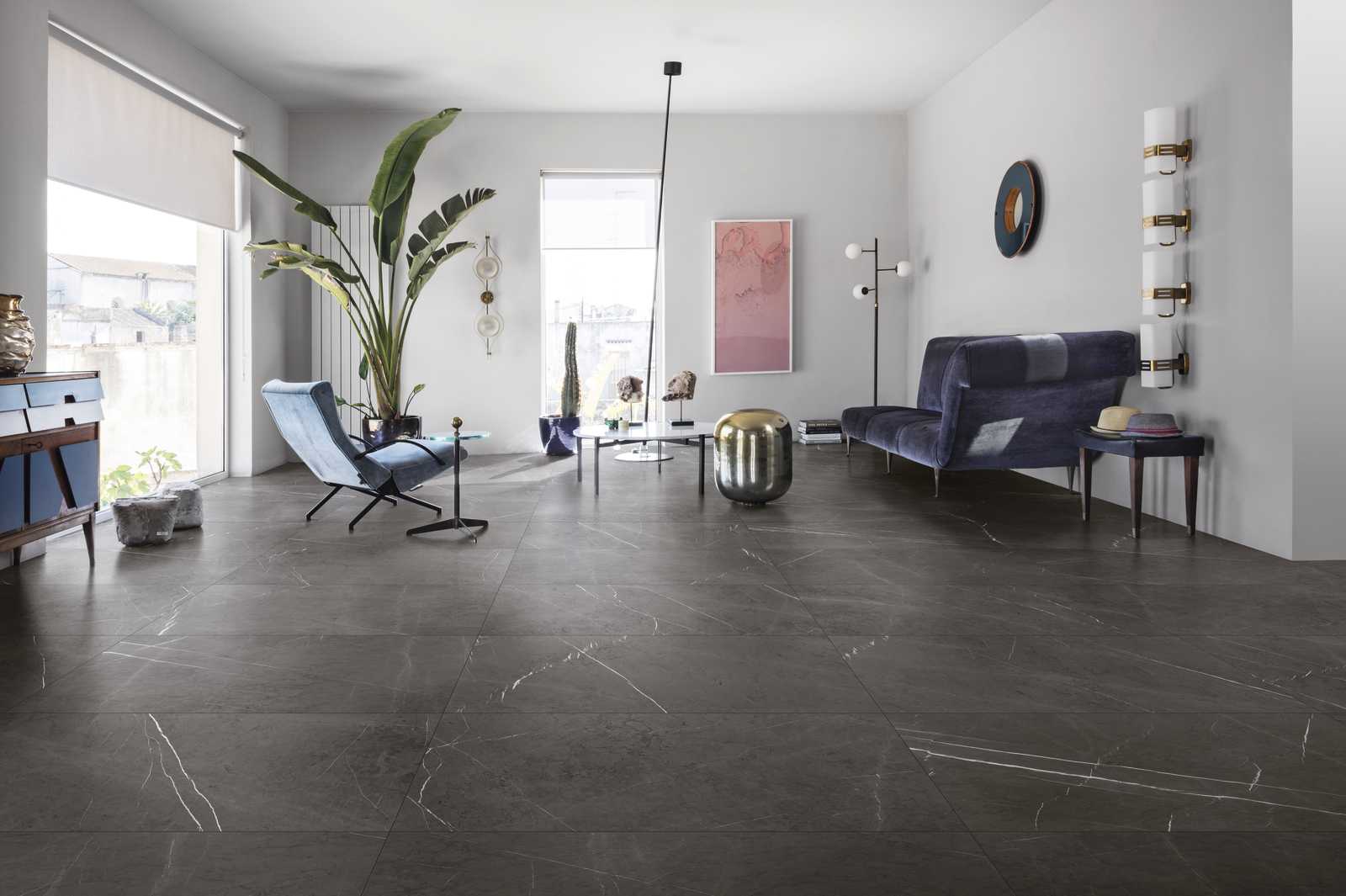 Warm dining room with travertine-look porcelain floor tiles and timber table